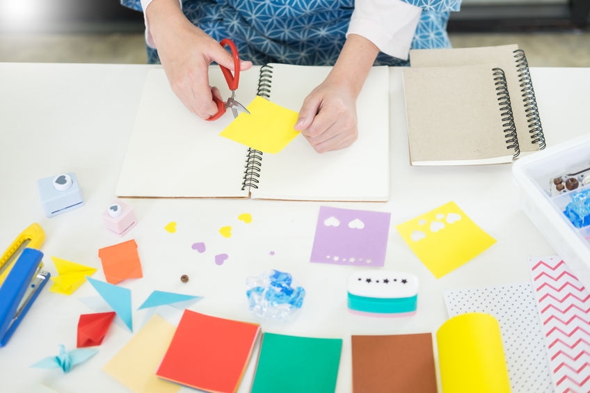 image woman cutting paper