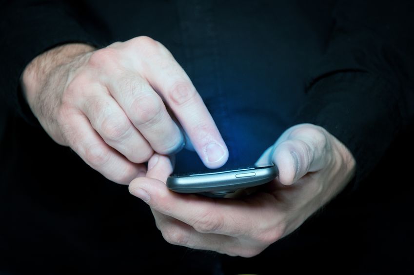 man holding cell phone